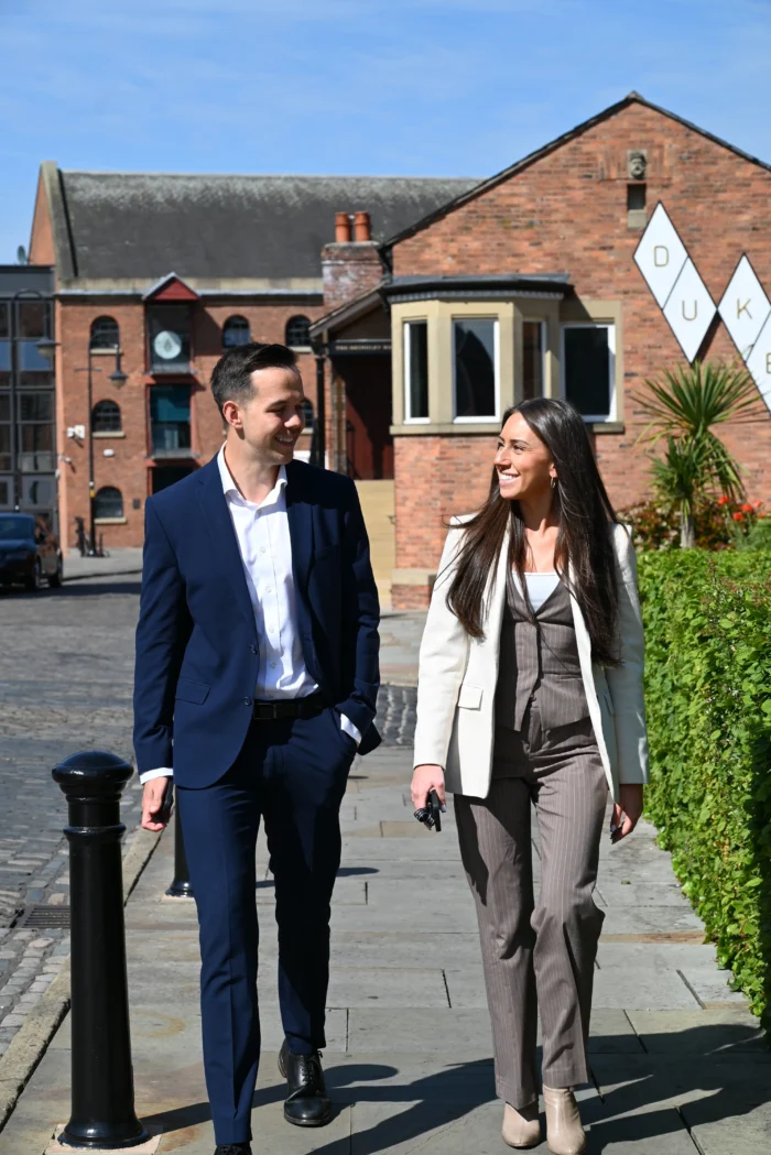 Lucy Cresswell and Russell Kaminski taking a walk outside.